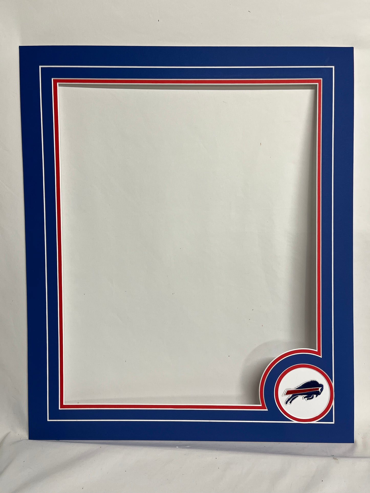 20x24 mat (16x20 photo) with team logo patch.